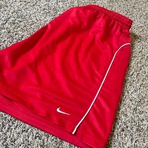 RED Nike athletic shorts.